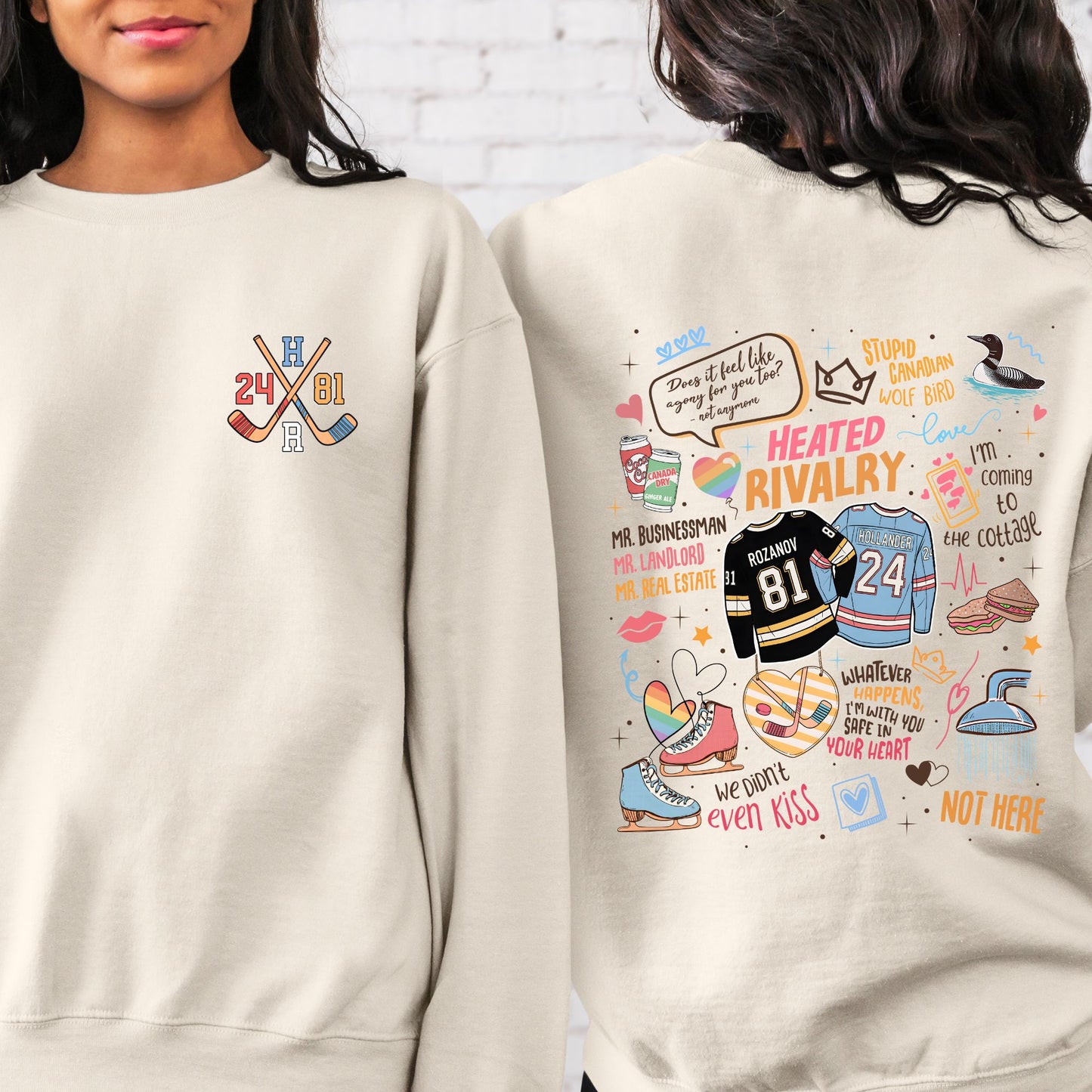 Two beige sweatshirts, one with hockey-themed graphics and text, the other with colorful illustrations and text.