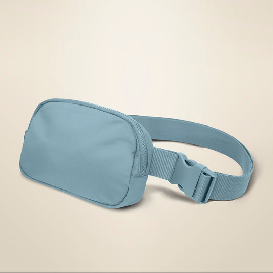 Light blue waist bag on a beige background